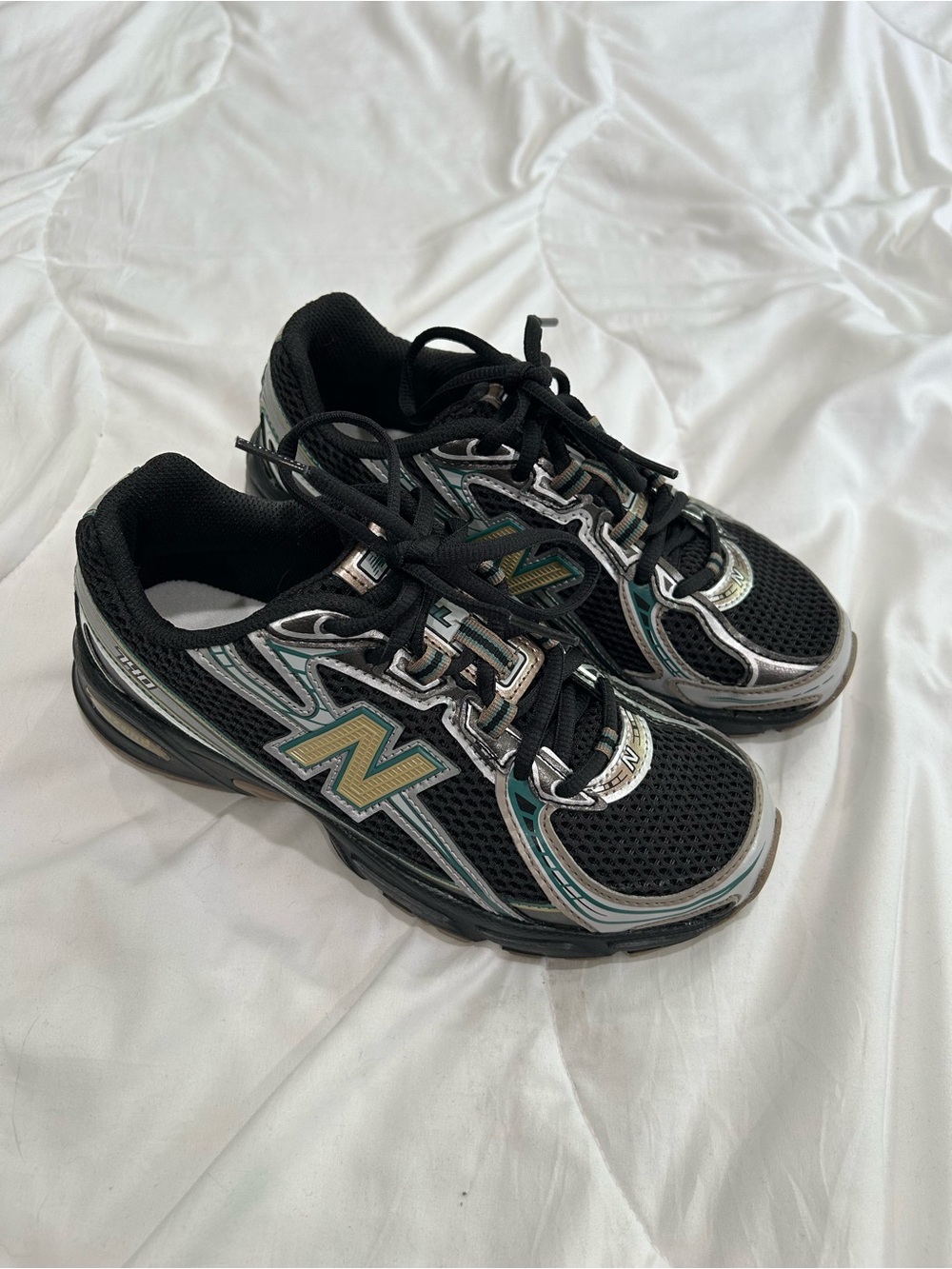 Women’s New Balance Black Sneakers with Teal and Metallic Accents
